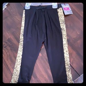 Black drawstring pants with gold speckle sides